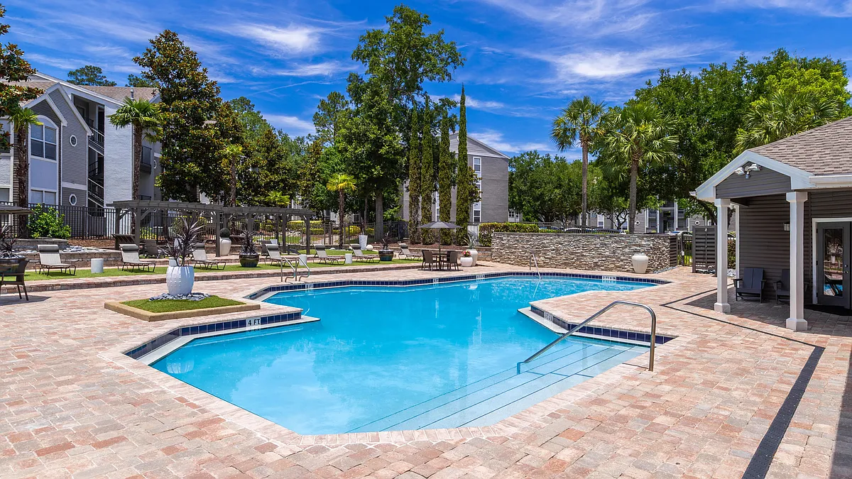 Whether you're catching rays or enjoying poolside conversation, our expansive sundeck is the perfect place to unwind. - The Oasis at 1800
