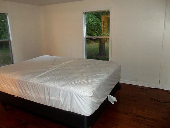 Master Bedroom with hardwood floors Family