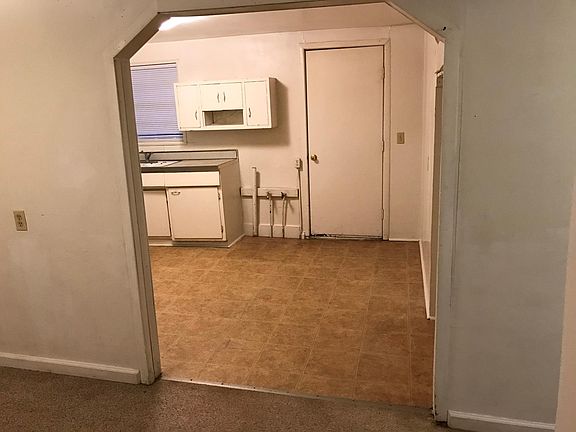 Looking from the Living room into the kitchen at the back door