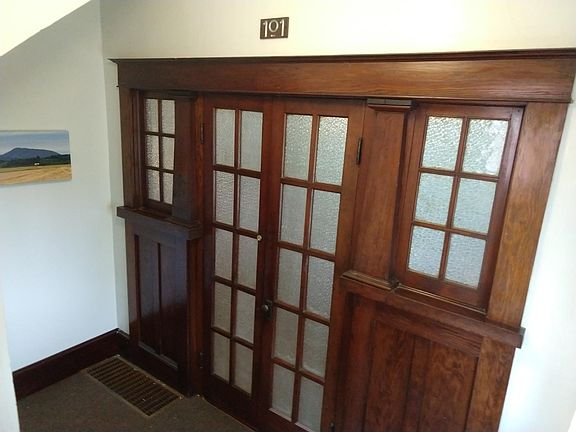 Unit 101 main entrance with original woodwork