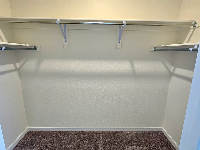 Massive walk in closet in master bedroom.