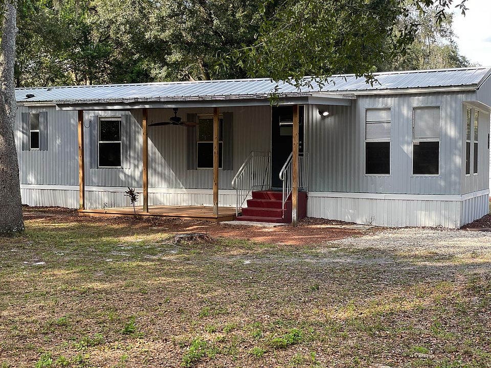 Located on a private lot with a front covered porch.