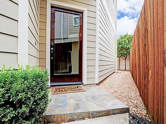 As you walk to the private entrance of 113 Riley Lane, you are greeted by a slate covered landing.