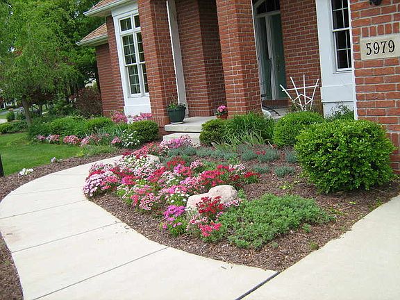 Beautifully landscaped yard
						:
						front porch