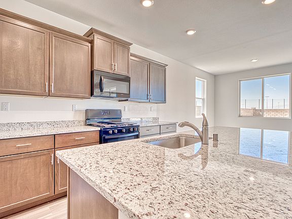 The kitchen comes with a full suite of energy-efficient appliances.
