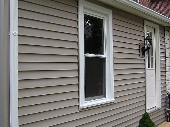 new add'n. vinyl siding/outdoor lighting/door/gutters