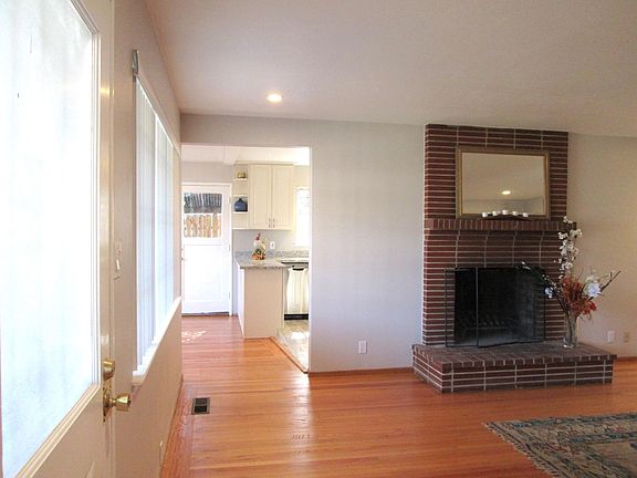 Living room with view of kitchen