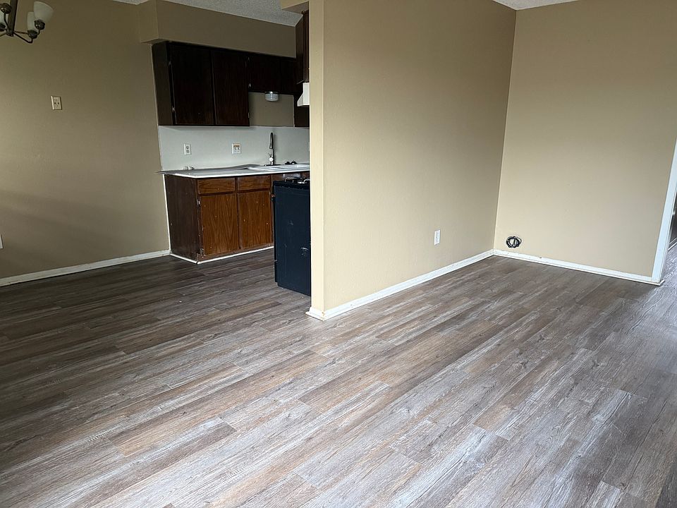 Open plan with living area flowing into the dining area and kitchen