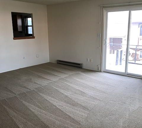 Living room with slider to deck