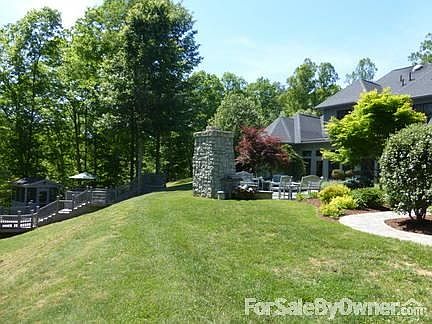 Rear of home showing fireplace and deck