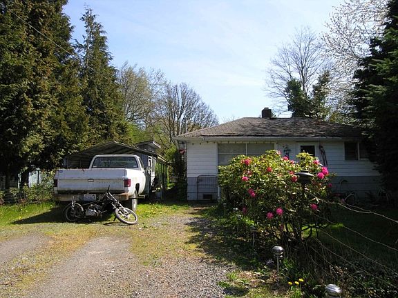 Driveway, shed in back, 19536 sq. ft. lot. At least 2 duplexes possible.