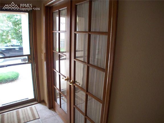 Front bedroom has glass french doors, could make perfect study.