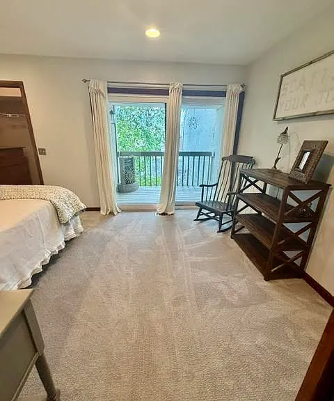 Second Story Primary Bedroom with Queen Plus Bed, Walk-In Closet, balcony and Gas Fireplace.