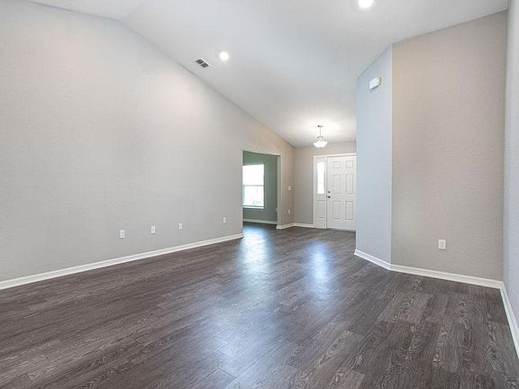Spacious gathering room with stylish and low-maintenance wood vinyl plank flooring - New home for sa