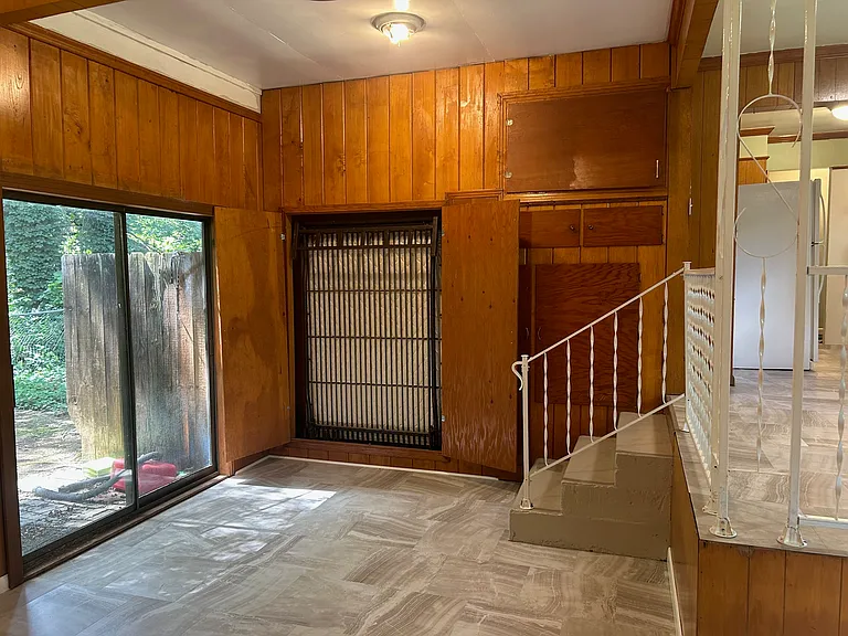 murphy bed folded up into wall, doors open
