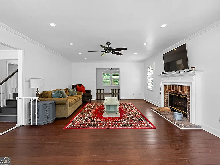 Living Room with Fireplace and Bay Windows
