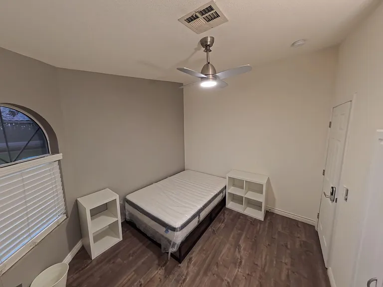 Comfy room with new memory foam bed, desk, LED lighting, ample storage & scenic views through 3 tinted street-facing windows.