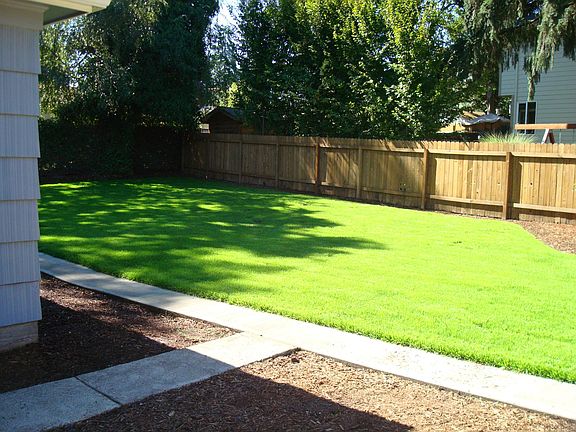 Very large, fenced in back yard.