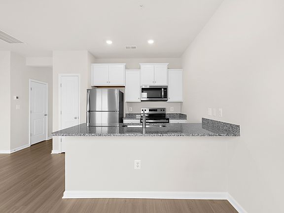 The Kitchen comes with stainless steel appliances