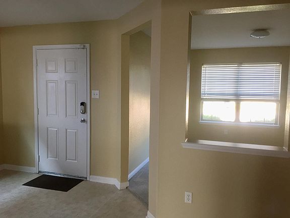 Foyer with view of office room