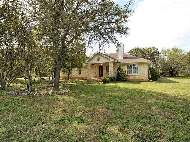 Gorgeous, Private single story home on 2 wooded acres. New roof shingles. 4 sides texas Limestone.