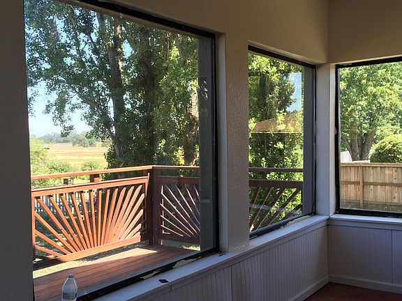 Walk in to sunroom looking out over laguna farmland