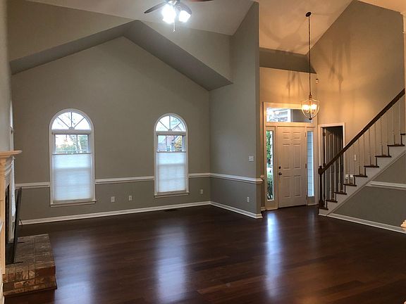 Living room with vaulted ceiling and Brazilian Cherry hardwood floors