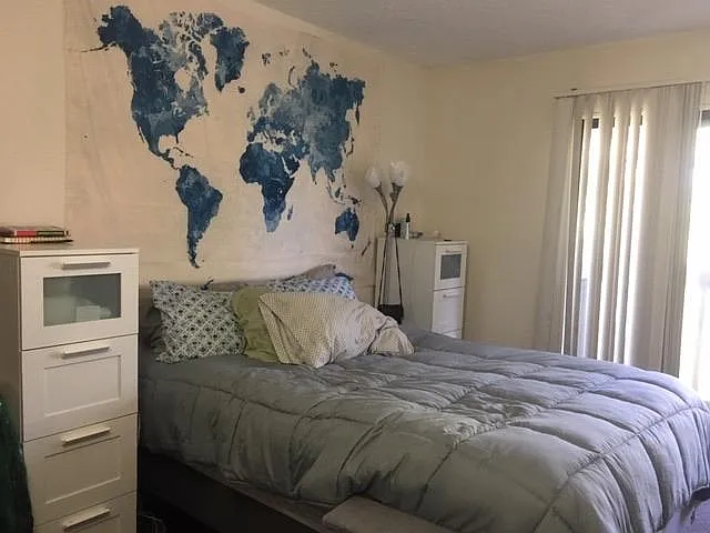 Nicely sized bedroom with sliding doors to private balcony.