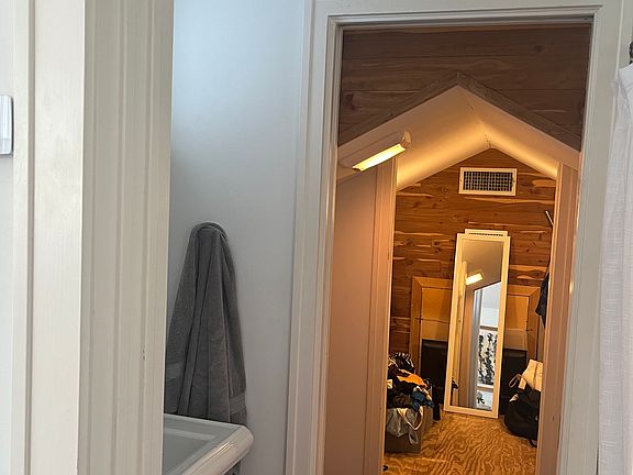 Sink opposite shower closet view