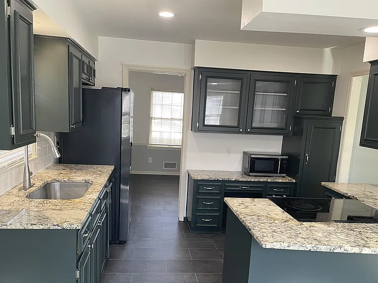 New luxury vinyl flooring seamless flowing from kitchen to dinning room.