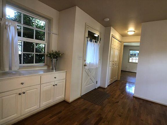 Hallway from living room to kitchen, dining room, laundry and ground floor bedroom