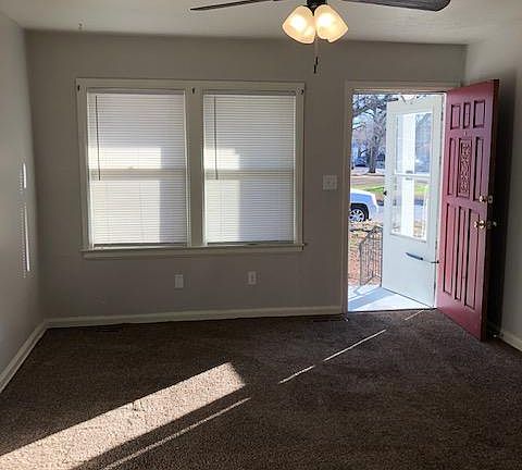 Living room/entry. New ceiling fan, new paint.