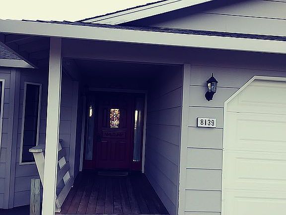 front door and 2 car garage