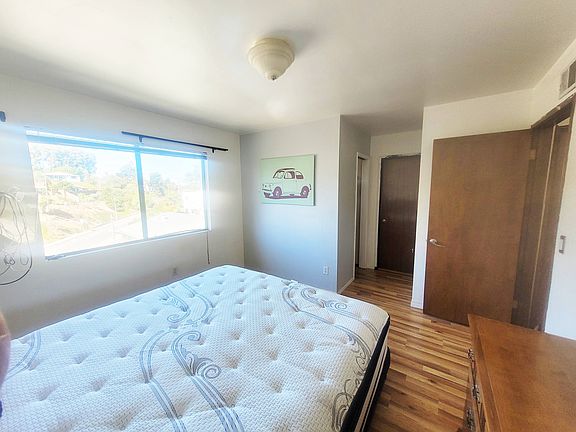 Room includes private walk-in closet and direct access to shared bathroom