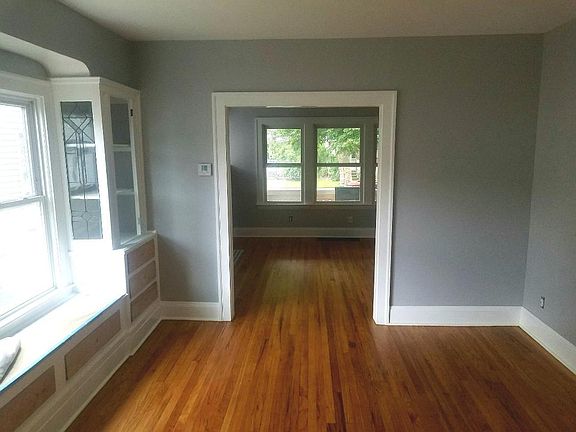 Large dining room, window seat, china cabinets with drawers