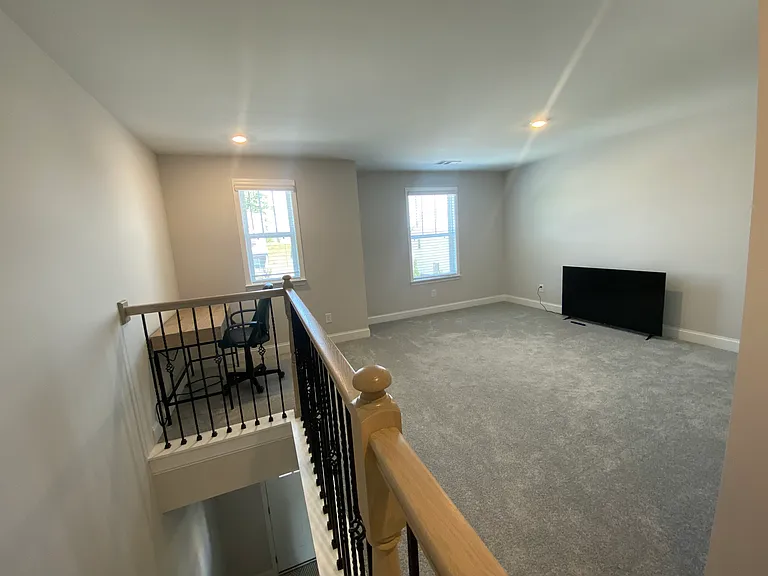 Open loft upstairs. Great for office, movie room, fitness, blowup mattress for guests etc.