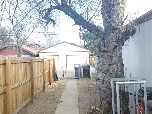 View from back entrance. One parking space