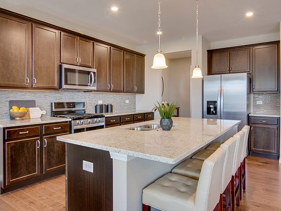 Kitchen with Pendant Lighting and Stainless Steel Appliances