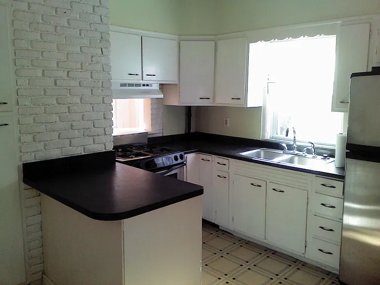 Kitchen is being remodeled. New quarts counters, new cabinets, restore hardwood floors.