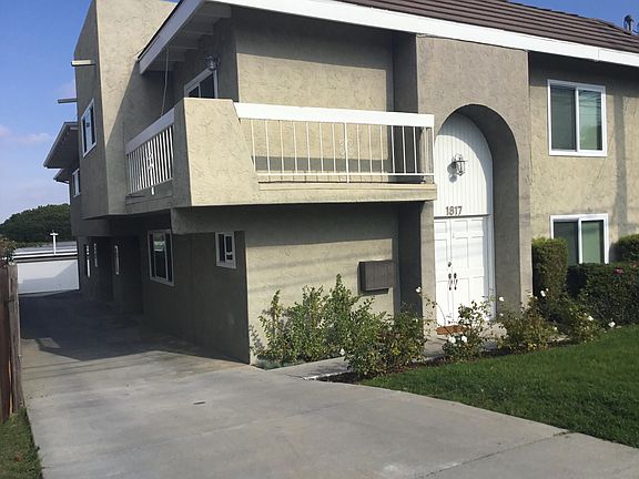 Driveway to garages in rear.