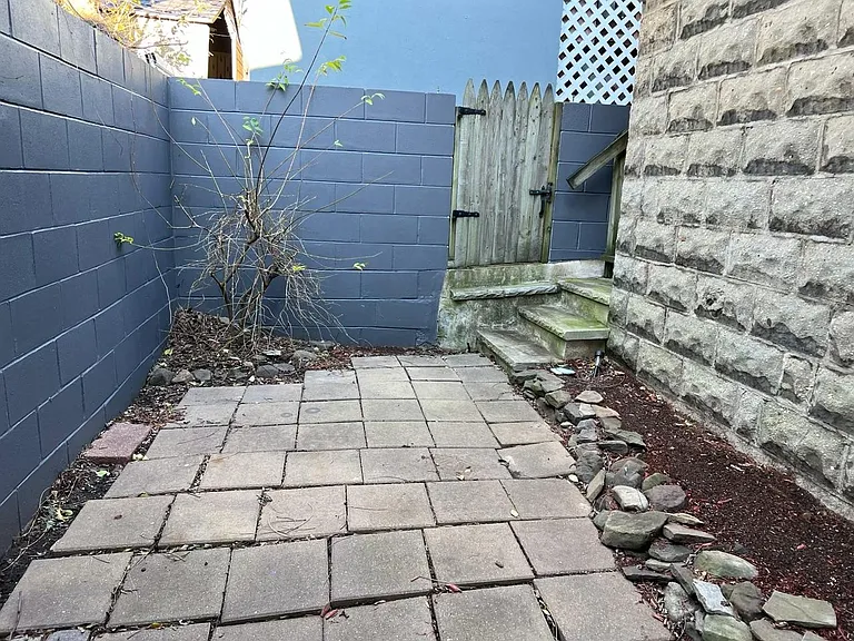 Private walled rear garden can be accessed directly from Primary bedroom.