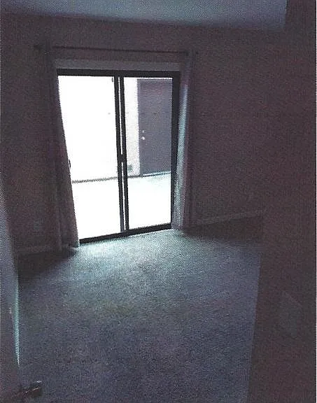 Downstairs Bedroom w/Sliding Door to Patio