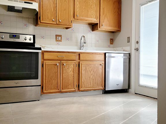 Kitchen with French doors leading to a nice deck.