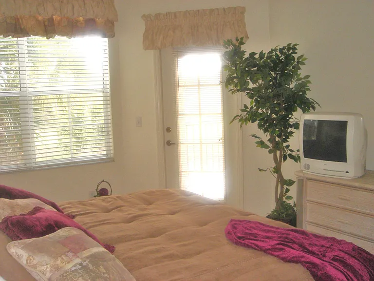 Master Bedroom with Wrap around Lanai entrance and TV