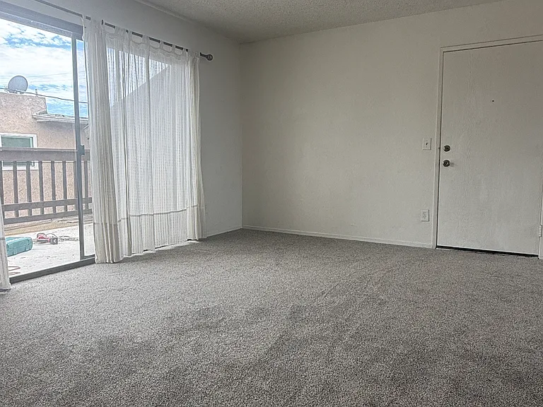 Living area leading to exterior large outdoor patio