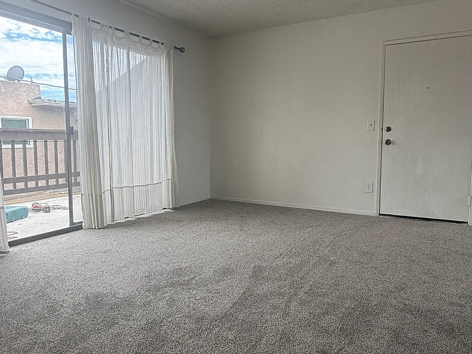 Living area leading to exterior large outdoor patio