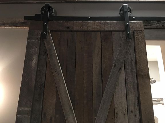 Custom made doors from vintage barnwood w forged hardware