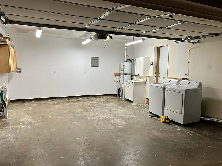 Large garage equipped with washer dryer. Direct access into living room.