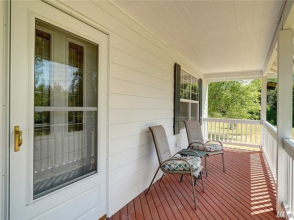 This covered front porch is the perfect place to sip your afternoon ice tea or lemonade. 