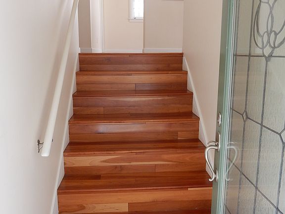 Private, secure, leaded glass door entry opens to staircase to the apartment.